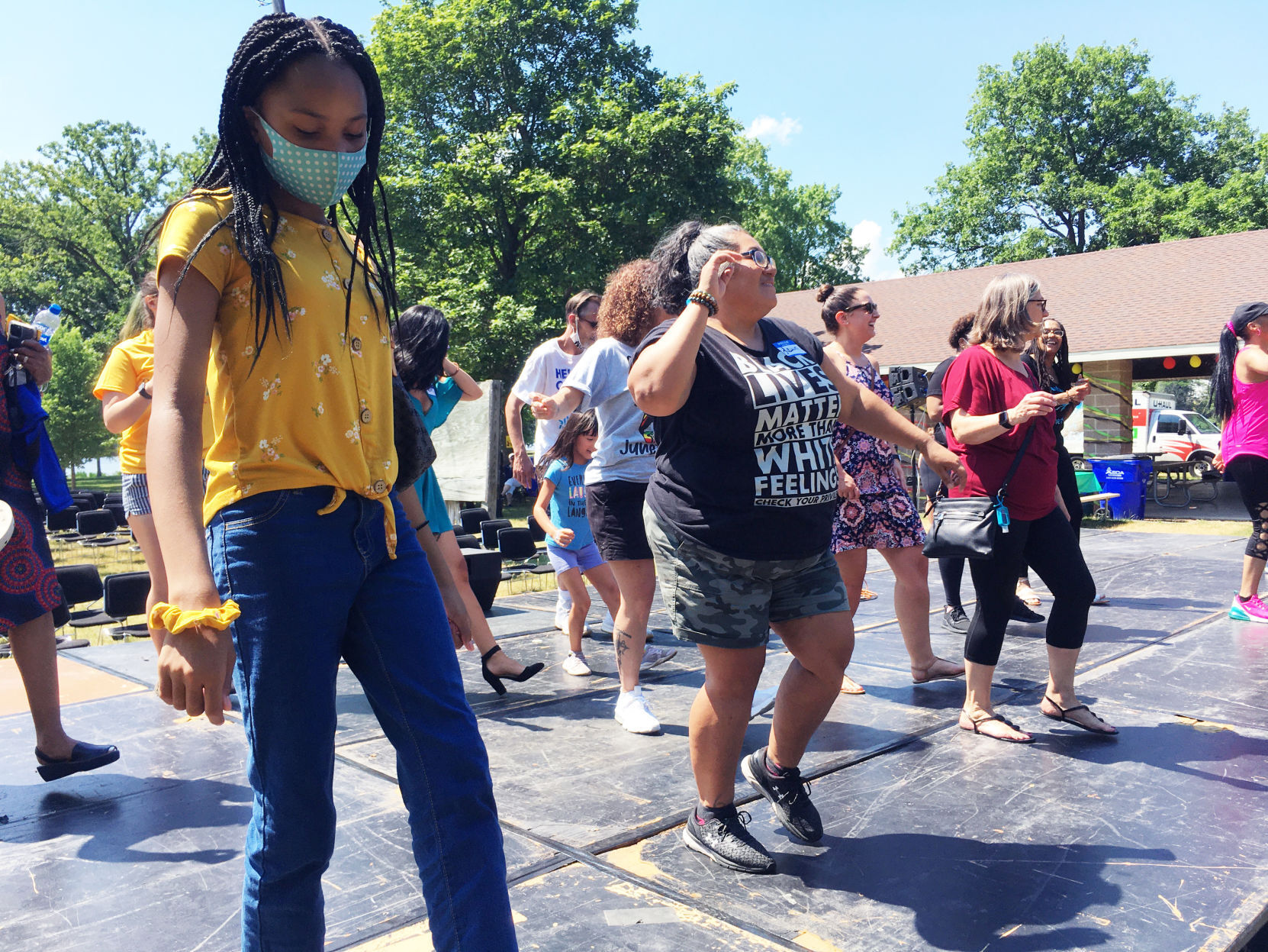 Casey Sellers and others dancing at Burlington Juneteenth event